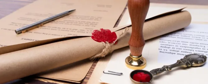 Documento de testamento com selo de cera e caneta sobre mesa, representando planejamento sucessório e herança em vida.